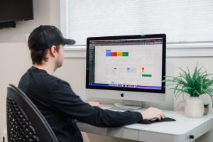 man working on a computer for data collection Spotted Fox Digital Marketing