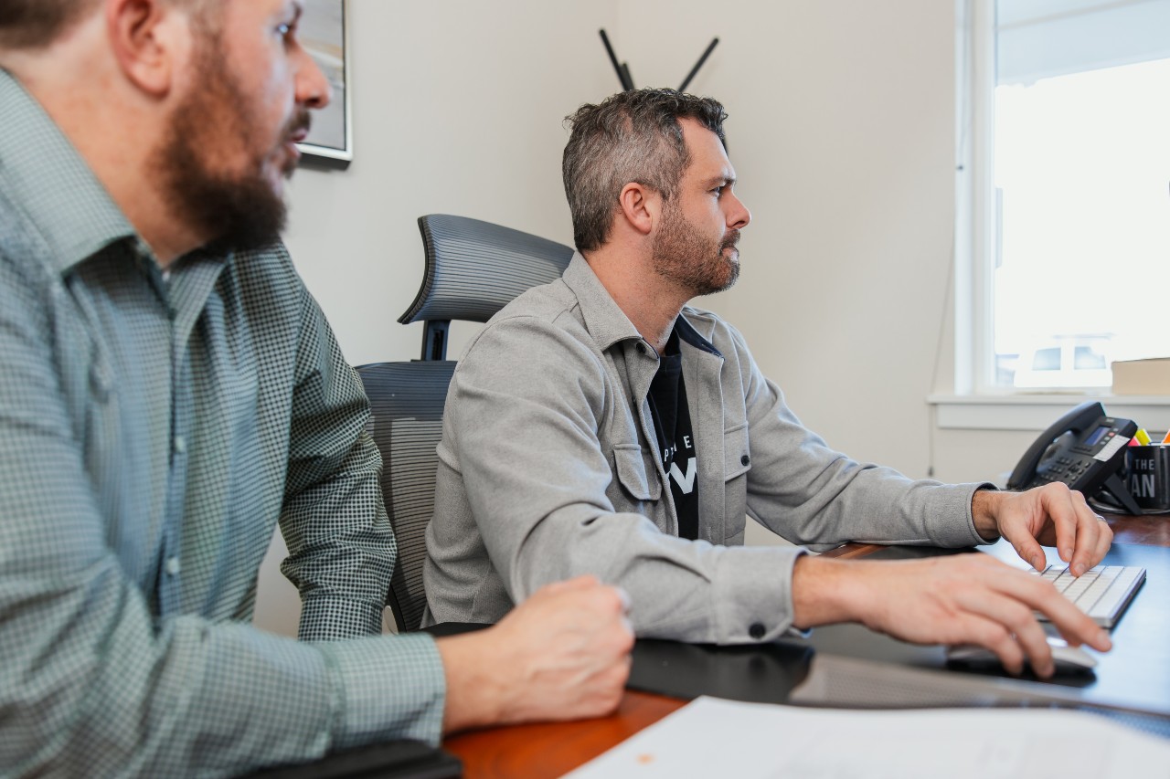 Nathan and Brad working on a desktop